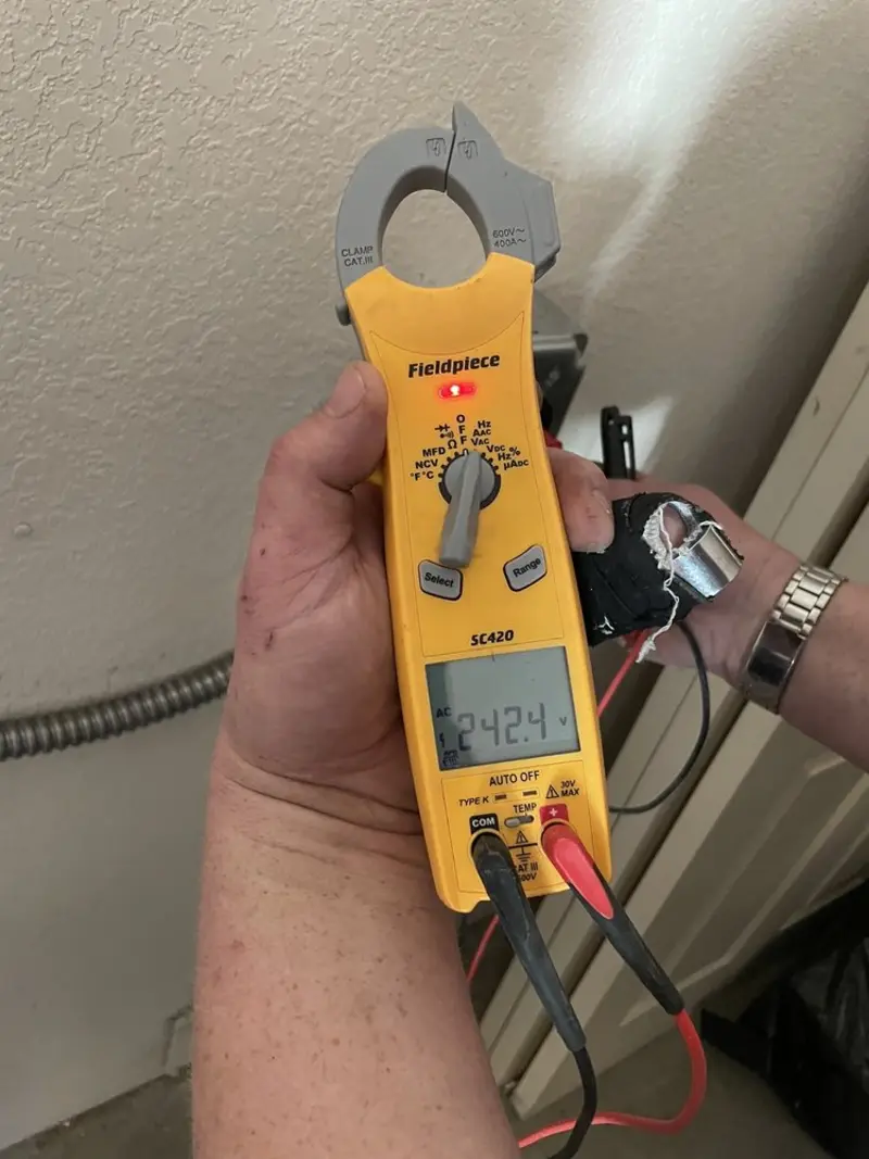 Voltage testing with clamp meter during Hot Tub / Pool Electrical Wiring in Liberty